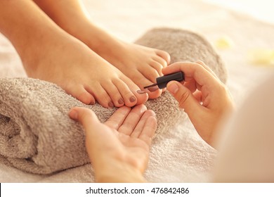 Woman Having Pedicure At Salon