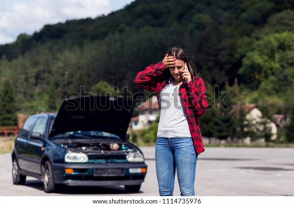 Woman having problem with\
her car 