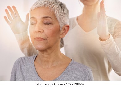 Woman having reiki healing treatment , alternative medicine concept, holistic care - Powered by Shutterstock