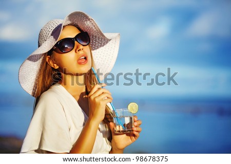 Similar – Woman applying sunscreen by the pool during summer