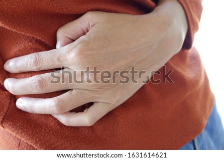 Woman having strong stomach ache