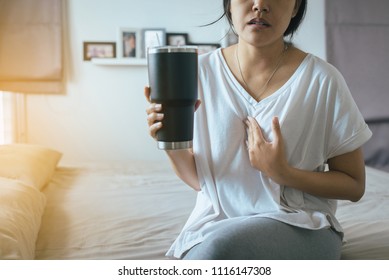 Woman Having Or Symptomatic Reflux Acids,Gastroesophageal Reflux Disease,Because The Esophageal Sphincter That Separates The Esophagus And Stomach Dysfunction