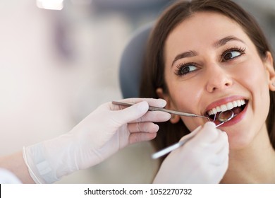 Woman Having Teeth Examined At Dentists