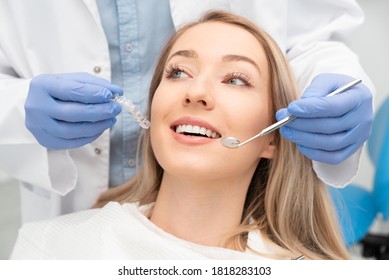 Woman having teeth examined at dentists. Teeth whitening, dental care concept