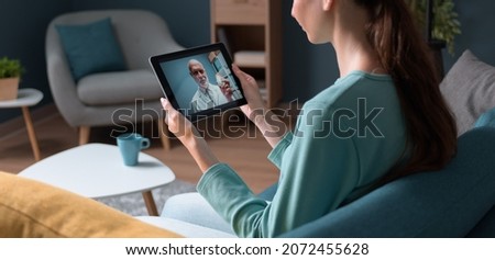 Similar – Female doctor showing an x-ray on the tablet