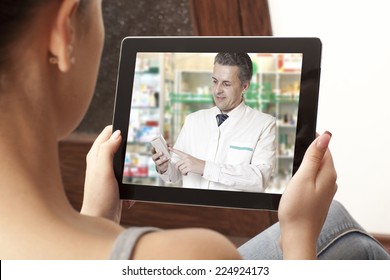 Woman Having Video Chat With Doctor On Laptop At Home