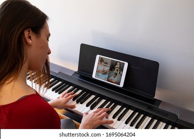 woman having video chat with friends and playing music - Powered by Shutterstock