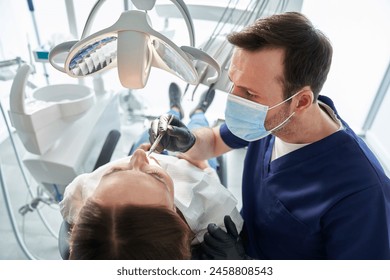 Woman having visit at the dentist - Powered by Shutterstock