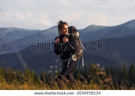 Woman having a walk. Majestic Carpathian Mountains. Beautiful landscape of untouched nature.