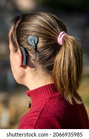 Woman Head With Cochleral Implant Hearing Aid