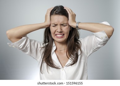 woman with headache and negative face expression