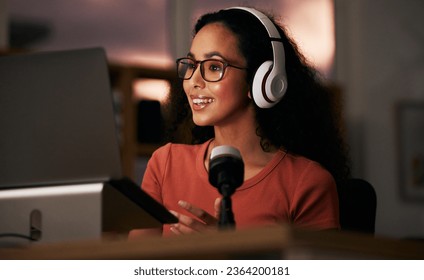 Woman, headphones and laptop with radio DJ or podcast, public relations journalist and live broadcast at night. Mic, talk show and communication for social media streamer and content creation - Shutterstock ID 2364200181
