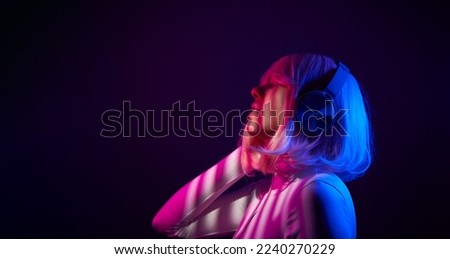 Similar – Young DJ woman in a night party