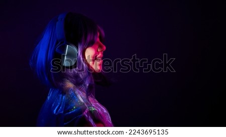 Similar – Young DJ woman in a night party