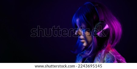 Similar – Young DJ woman in a night party