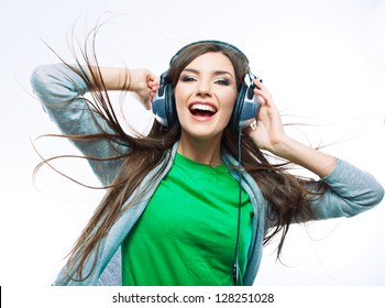 Woman With Headphones Listening Music . Music Teenager Girl Dancing Against Isolated White Background. Teen Life Style Concept.