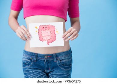 Woman With Health Intestine Concept On The Blue Background