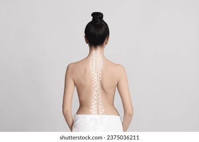 Woman with healthy back on light background. Illustration of spine