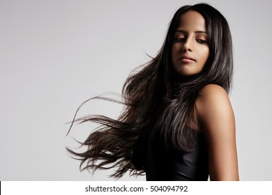 woman with healthy brunette hair in studio shoot