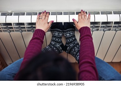 Woman Heating On A Chilly Winter Day, Energy And Gas Crisis, Cold Room, Heating Problems.