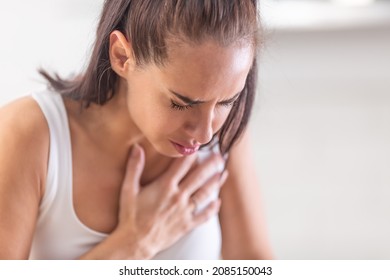 Woman Heeling Big Pain On Her Chest, Holding Hand Over Her Heart.