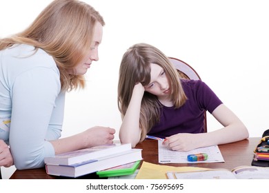 A Woman Helps His Child In Homework