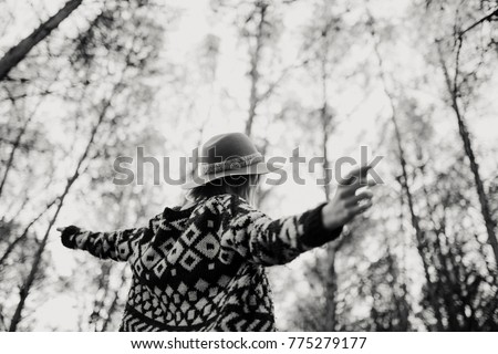 Similar – Image, Stock Photo Low angle view of blonde white girl posing in the forest with trees in the background.