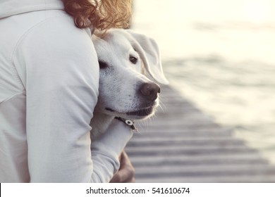 woman and her dog together outdoors