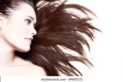 woman with her hair blowing and smiling