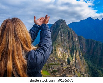 Woman With Her Hands Open Blessing Machu Picchu Incan Site, Over-the-shoulder Shot