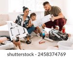 Woman with her husband and child are sitting on mattress among building materials and inventory. Married couple with cute kid are looking at house plan and discussing repairs. Apartment renovation.