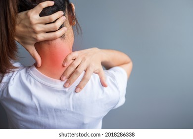 woman with her neck sprain, muscle painful during overwork. Girl having body problem after wake up. Stiff neck, office syndrome and ergonomic concept - Shutterstock ID 2018286338