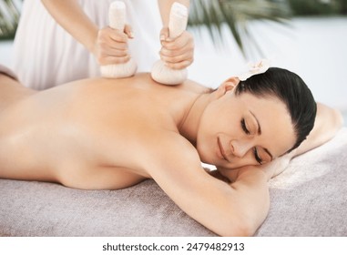 Woman herbal ball and thai massage, spa and zen wellness with masseuse in outside resort on holiday. Body care, treatment and pressure with organic instrument, comfortable and eyes closed or relax - Powered by Shutterstock