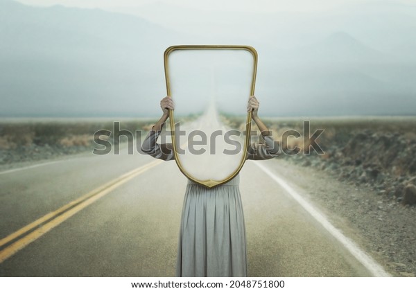 the woman hides holding a mirror in front of\
her face; introspection path\
concept