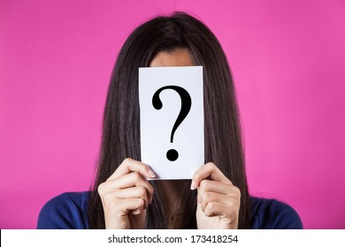 Woman Hiding Face Behind A Question Mark