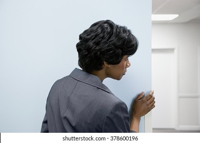 Woman Hiding Peering Round Corner