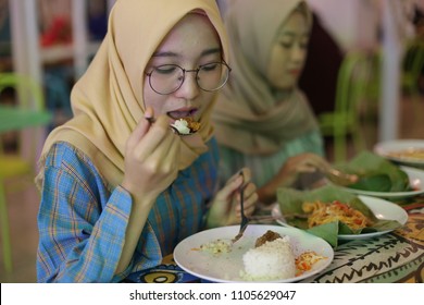 Woman Hijab Eating Food Nasi Lemak Or Nasi Padang In Halal Restaurant. Yogyakarta Indonesia. June 05, 2018