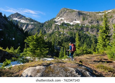 A Woman Hiker Among Stunning Peaks and Forest. 
North Cascades National Park, Washington