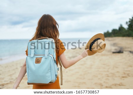 Woman hiker backpack travel beach vacation destination