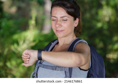 Woman Hiker Checking The Altimeter