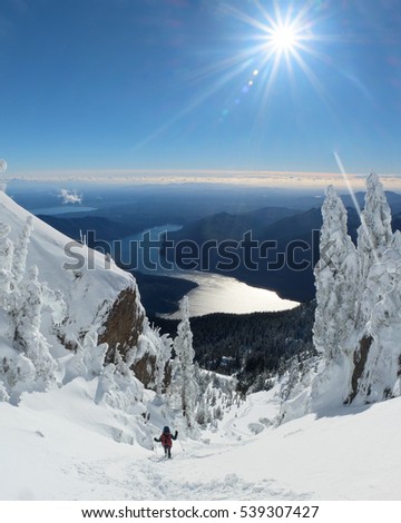 A Woman Hiker Descending A Snowy Mountain. 
Mt Ellinor, Olympic National Park, Washington.