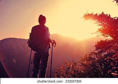 woman hiker enjoy the view at mountain peak  - Powered by Shutterstock