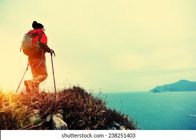 woman hiker hiking on seaside trail  - Powered by Shutterstock