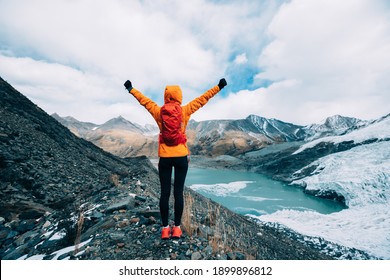 Woman Hiker Hiking  In Winter Mountains