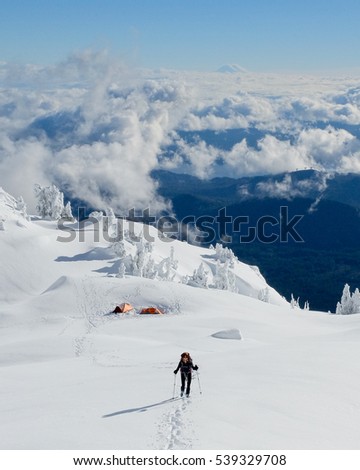 A Woman Hiker Leaving High Camp on Mt Ellinor. 
Olympic National Park, Washington.