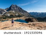 A Woman Hiker Picture with Lake Ingalls and Mt Stuart.
Alpine Lakes Wilderness, Cascade Mountains, Washington