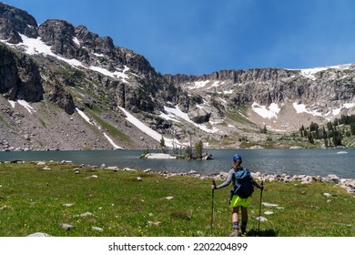 Woman Hiker Using Poles At Lake Solitude, A 17-mile Hike In Grand Teton National Park Wyoming