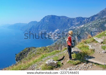 Woman hiker watching beautiful costal scenery - Path of the Gods 
