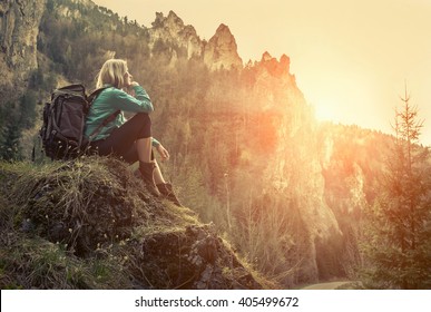 Woman hiking around mountains at spreeng time.