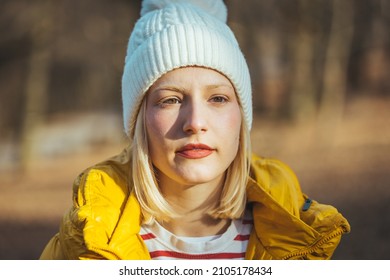 Woman Hiking In Autumn Forest. Candid Winter Young Woman Portrait. Winter Portrait Of Happy Beautiful Young Blonde Woman. Happy Blond Woman Warming